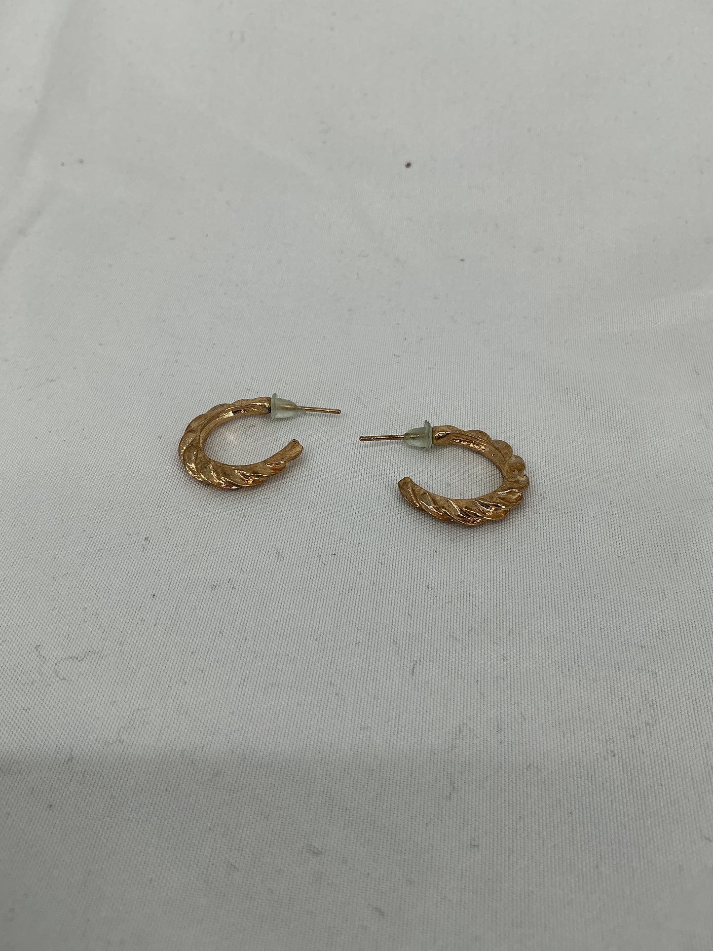 Gold twisted semi-circular earrings