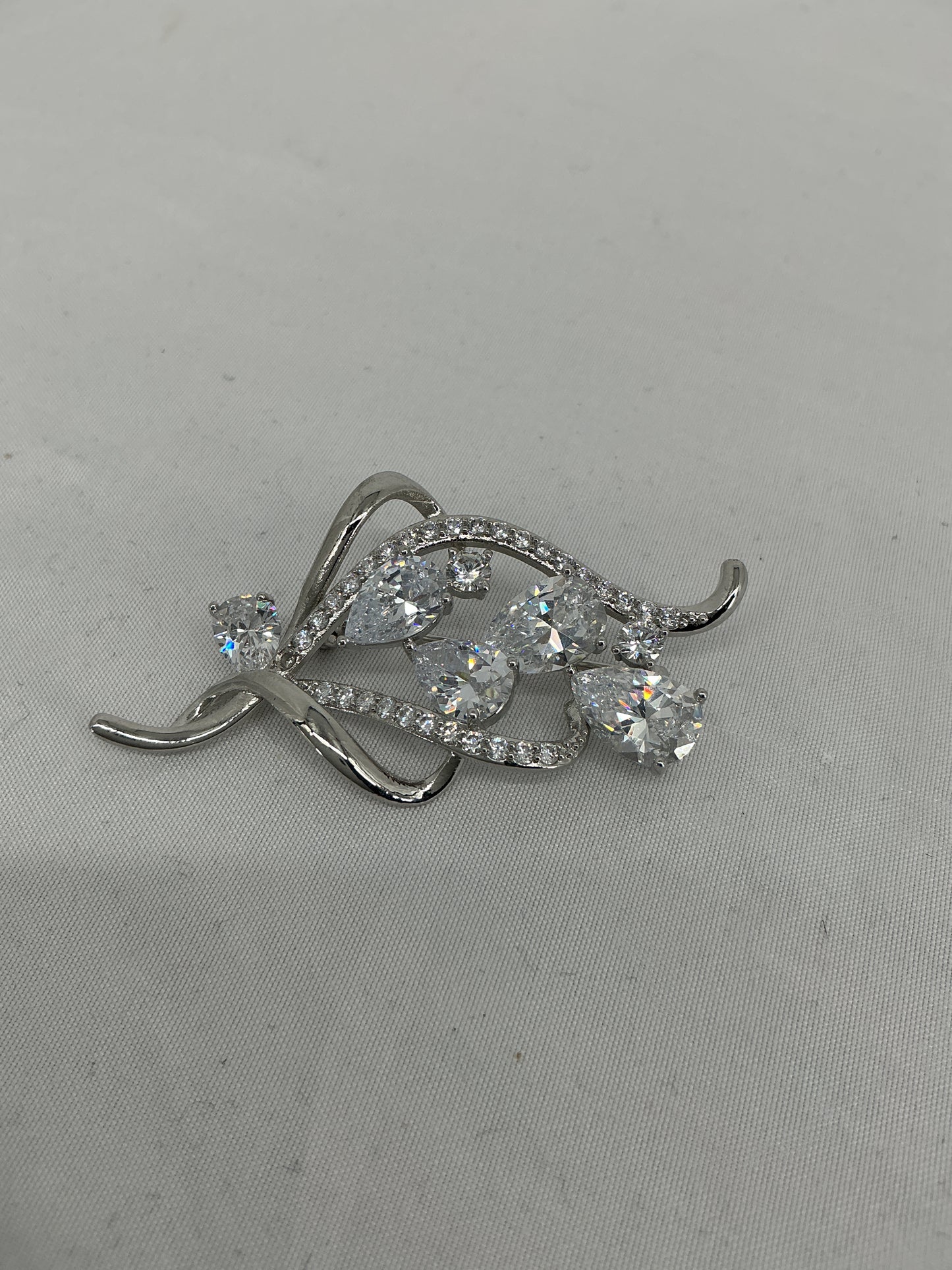 Fluid Radiance Swirl Brooch