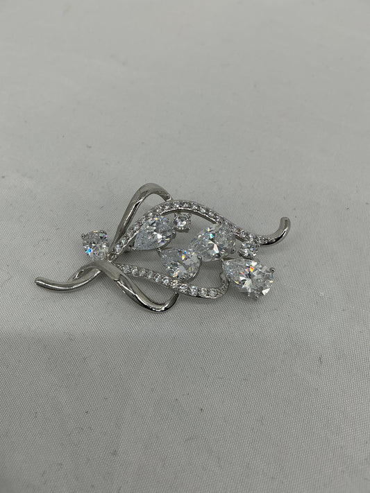 Fluid Radiance Swirl Brooch
