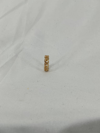 A gold ring, designed in a chain (Cuban link) style with an open-ended design.