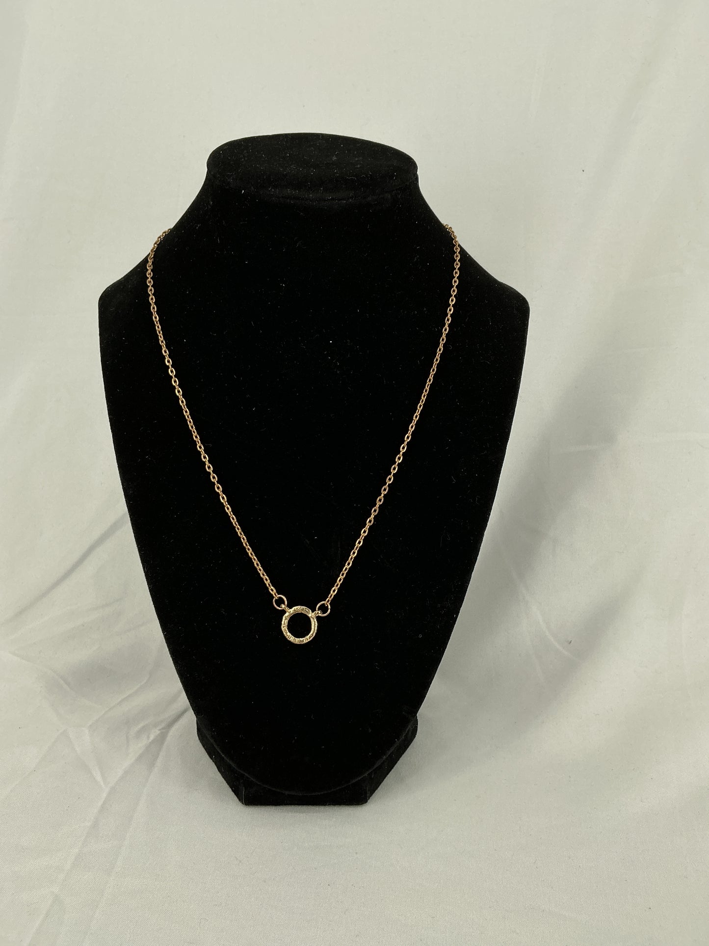 Gold circle pendant