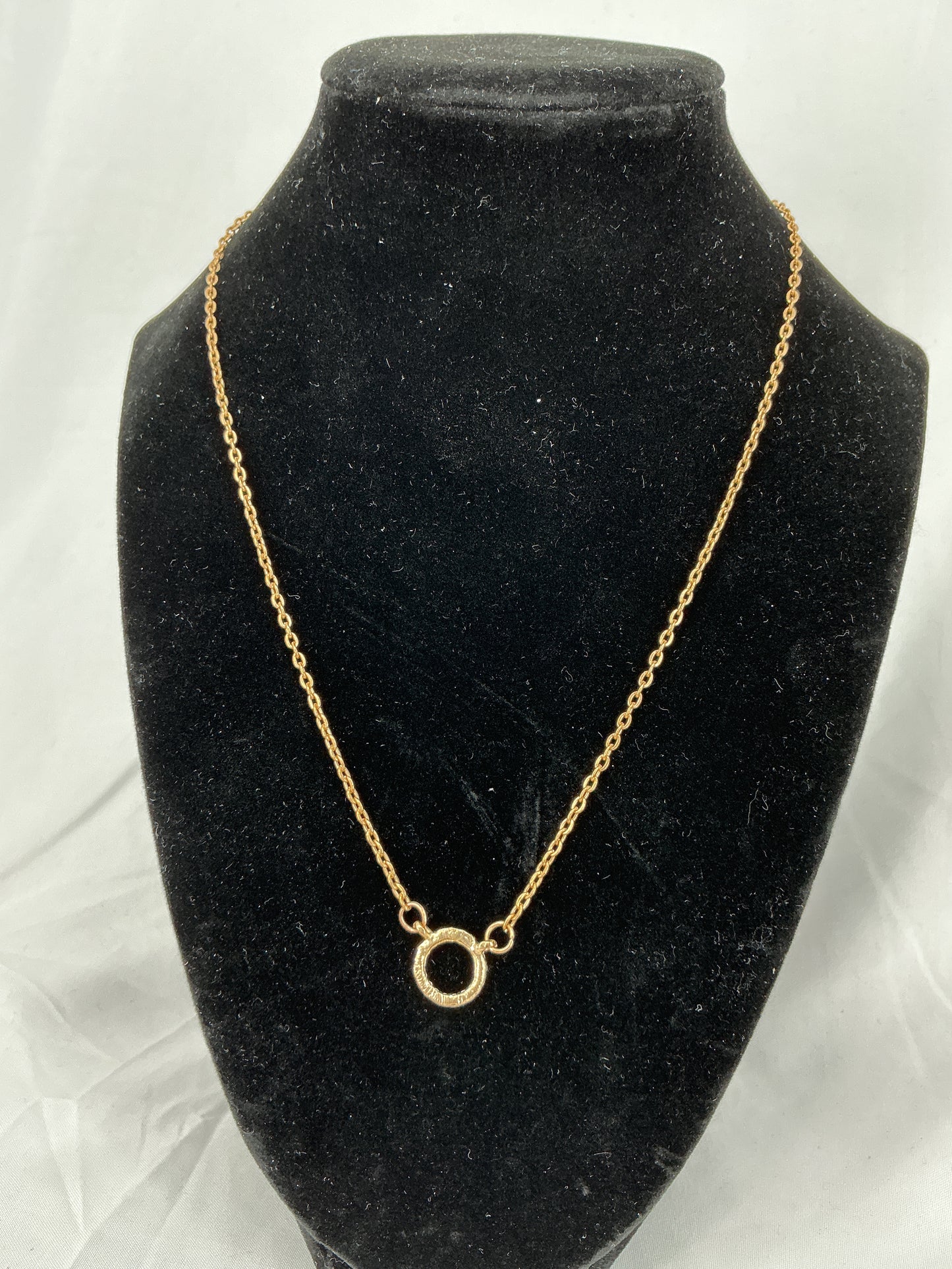 Gold circle pendant