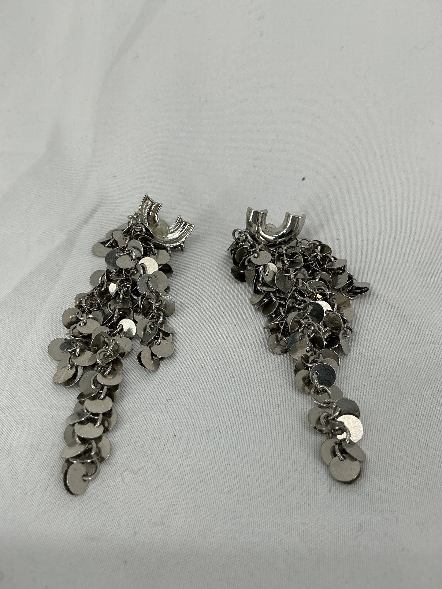 Silver sequined tassel earrings