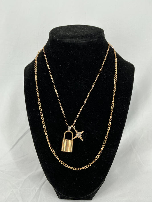 Gold padlock and North Star pendant necklace