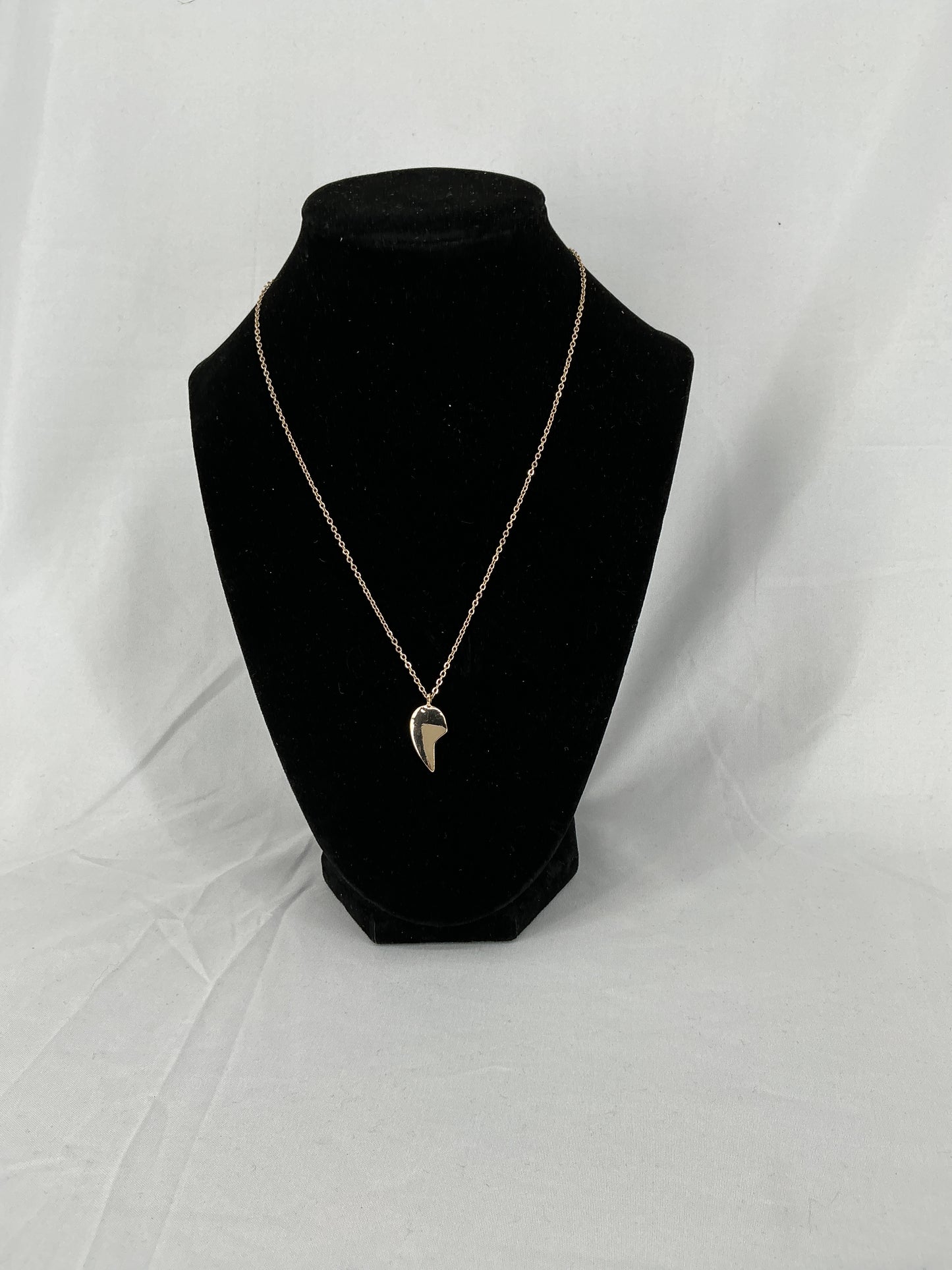 Gold half-heart pendant necklace