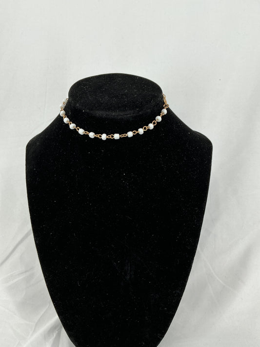 Gold chain necklace with white beads