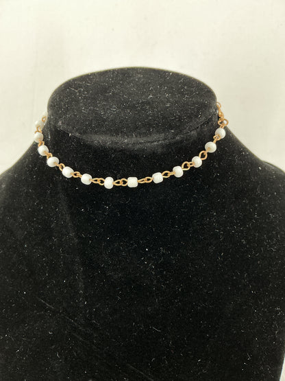 Gold chain necklace with white beads