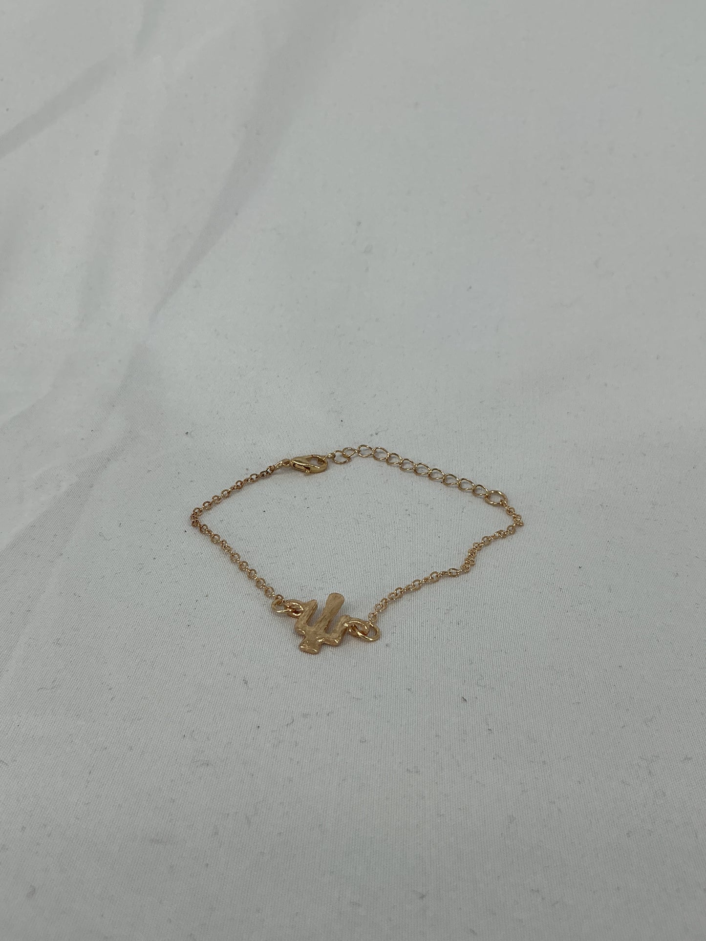 Gold-colored cactus-shaped bracelet