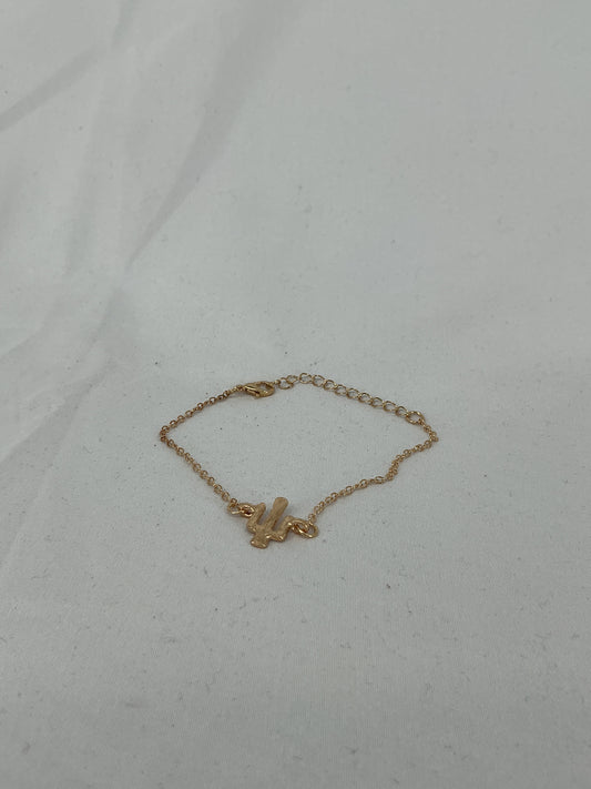 Gold-colored cactus-shaped bracelet