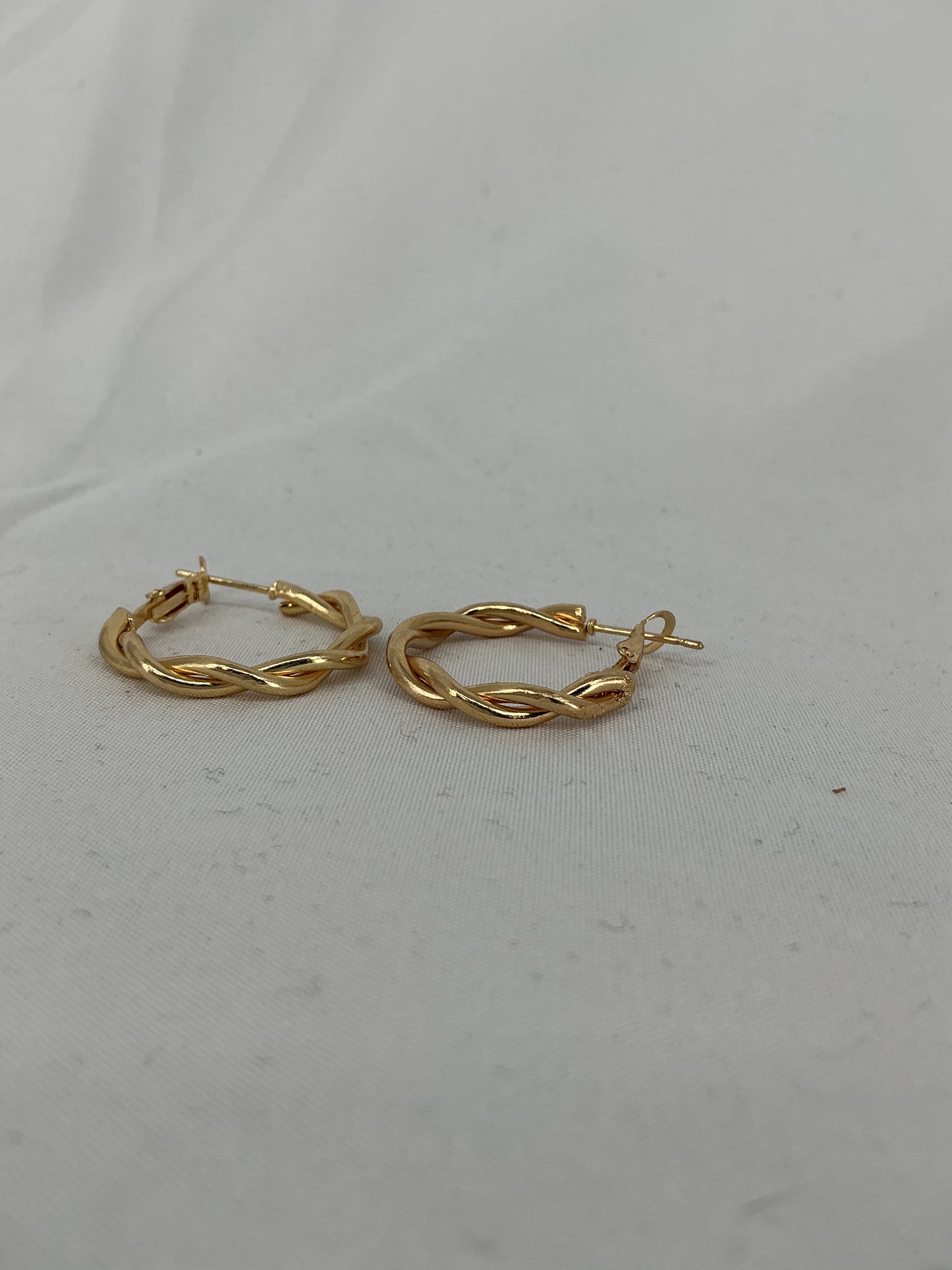 Gold twisted hoop earrings