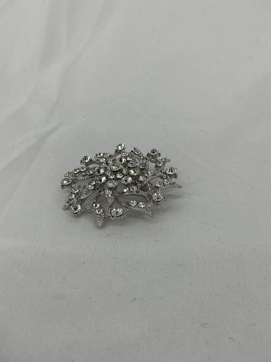 Silver radial rhinestone brooch