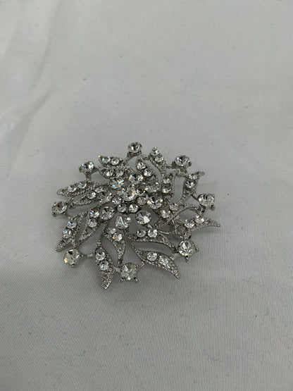 Silver radial rhinestone brooch