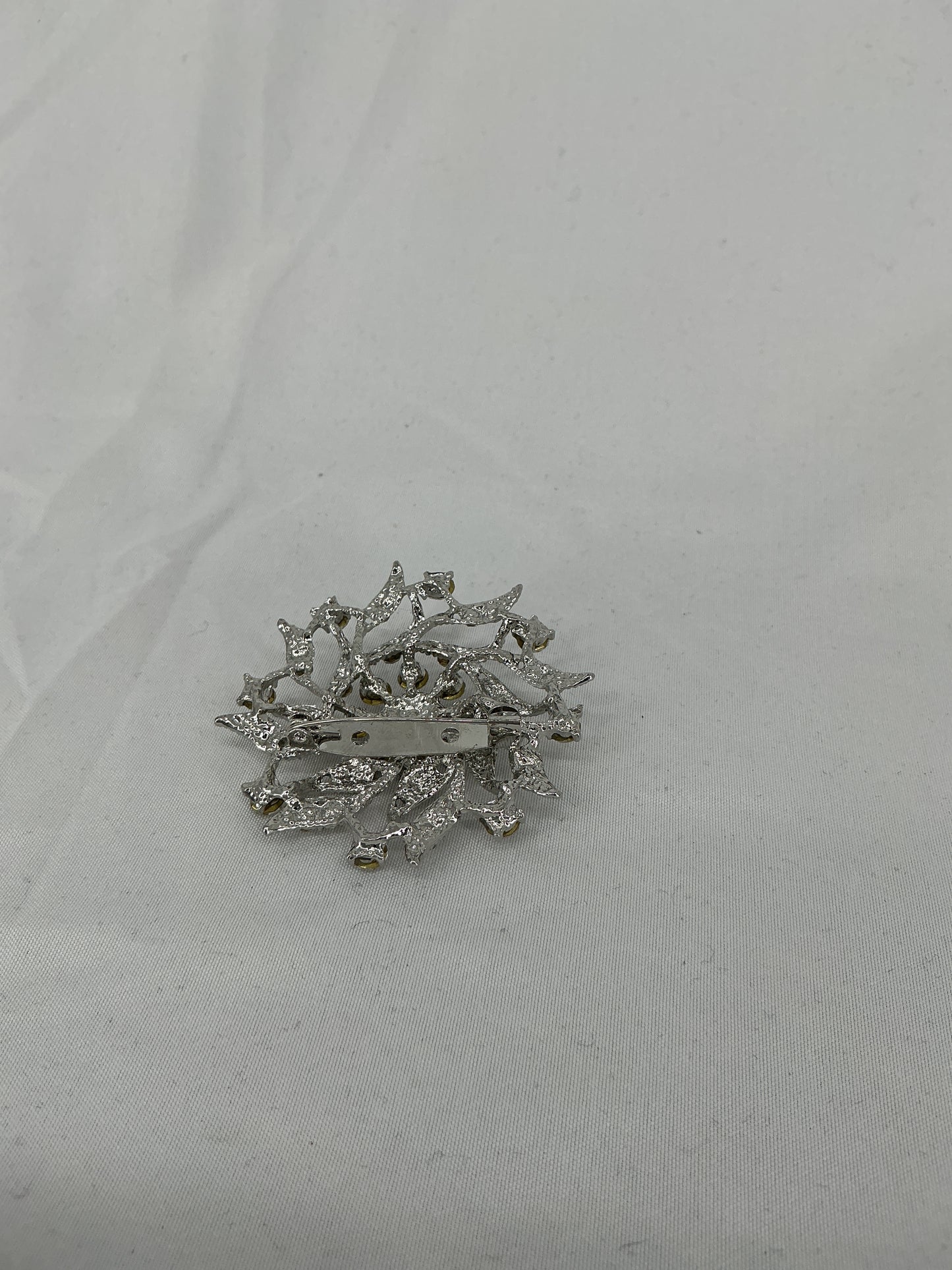 Silver radial rhinestone brooch